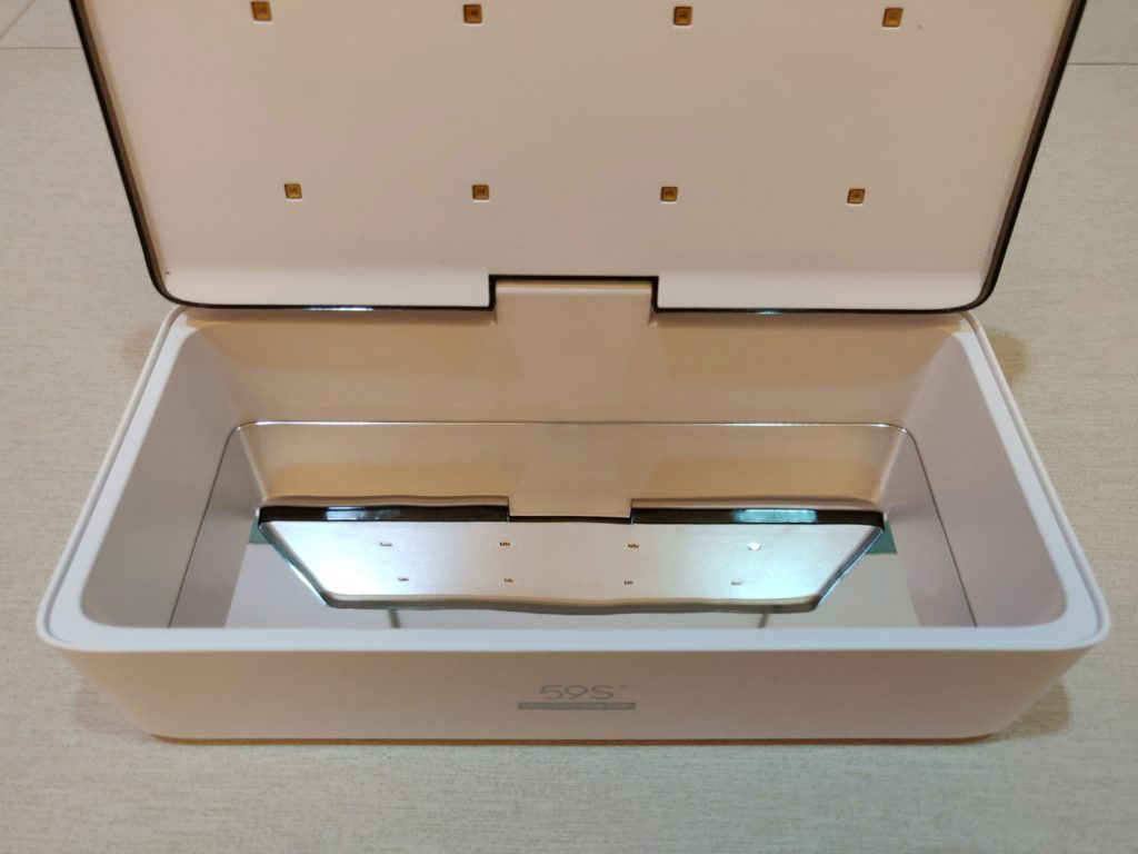 The mirror at the bottom of the 59S UVC Sterilizer box.