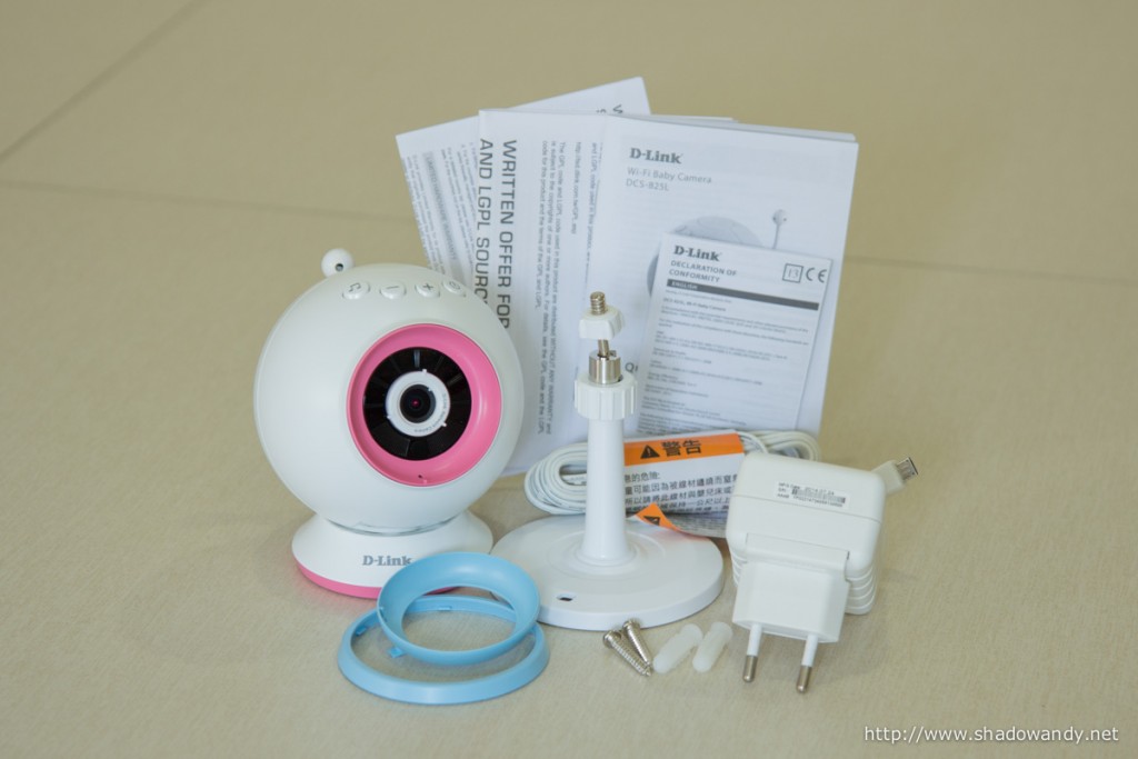 The package contains the WiFi Baby Camera, Power Adapter. Wall Mount Kit & Desktop Base, Pink/Blue Accent Rings and Installation Guides.
