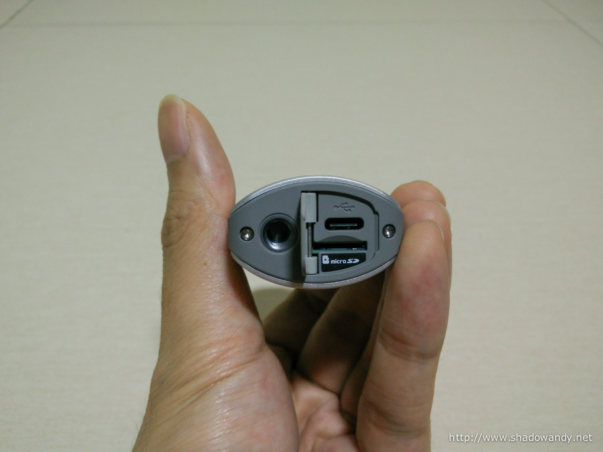 1/4-inch tripod mount. USB-C charging port and microSD slot under the trap door.