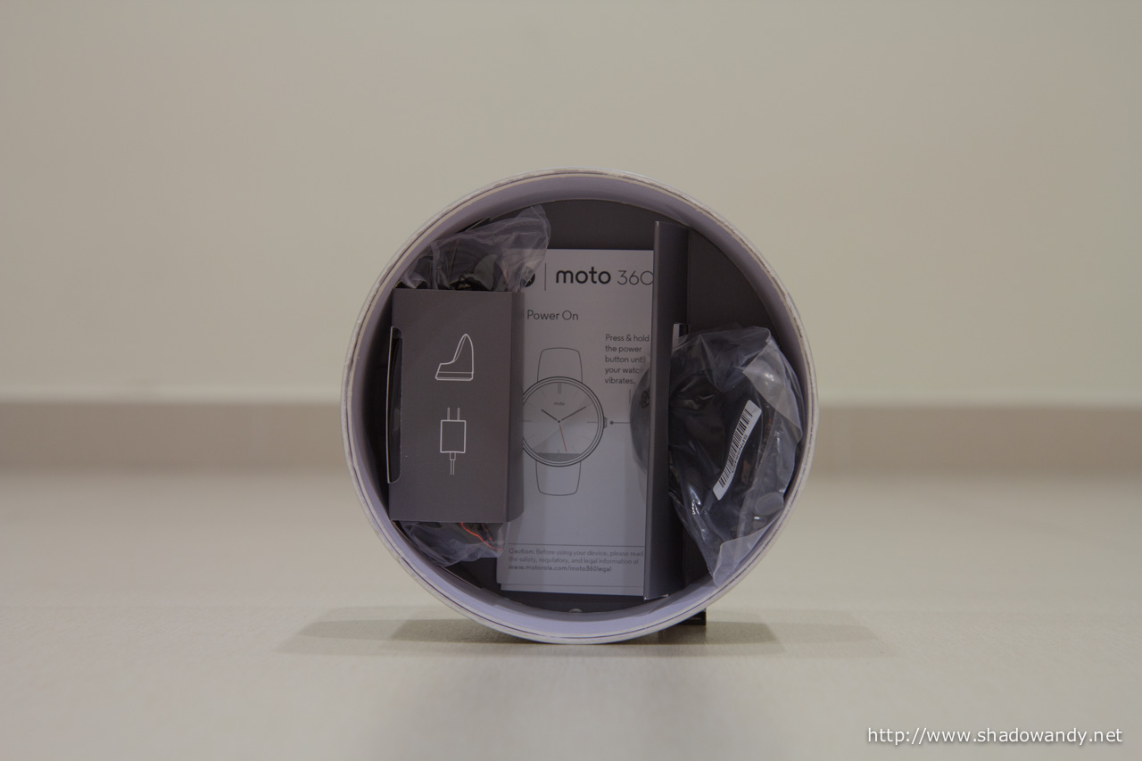 The wireless charging base, power adapter and user guides on the second layer