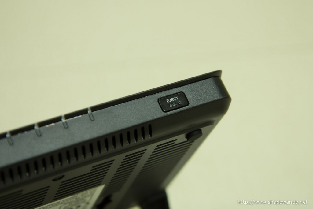 The eject button for safe mass storage device unmount at the front of the Synology RT1900ac.