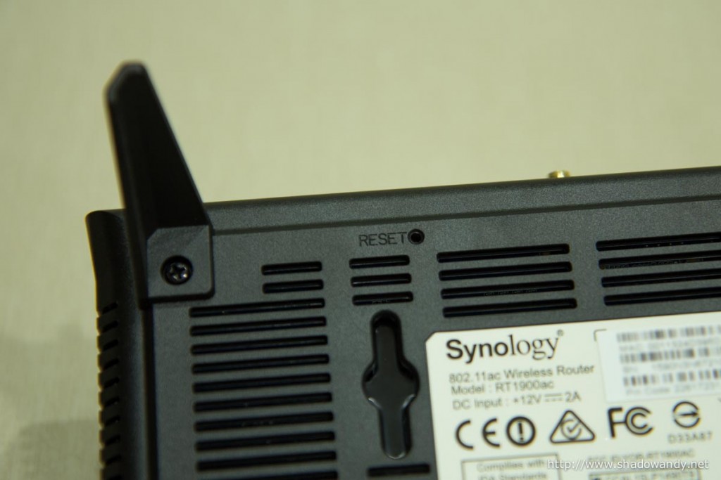 The reset button underneath the Synology RT1900ac.