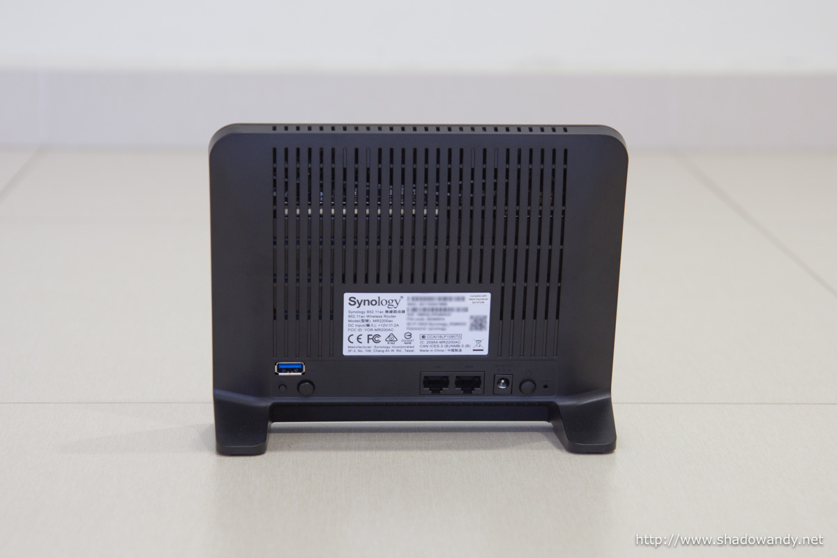 The ventilation vents are at the back. The connectors and buttons are near the bottom of the router.