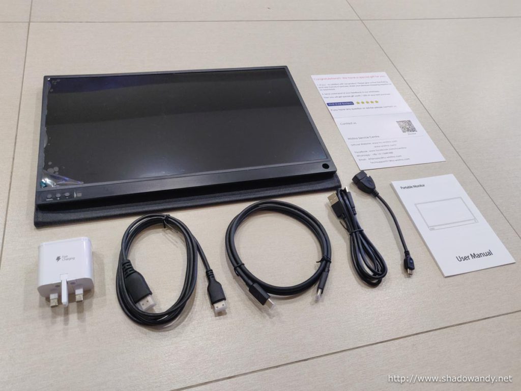 The Wistino 15.6-inch portable monitor, USB power adaptor, HDMI-to-mini-HDMI cable, USB-C Video Cable, USB-A to USB-C charging cable, OTG cable and User Manual.